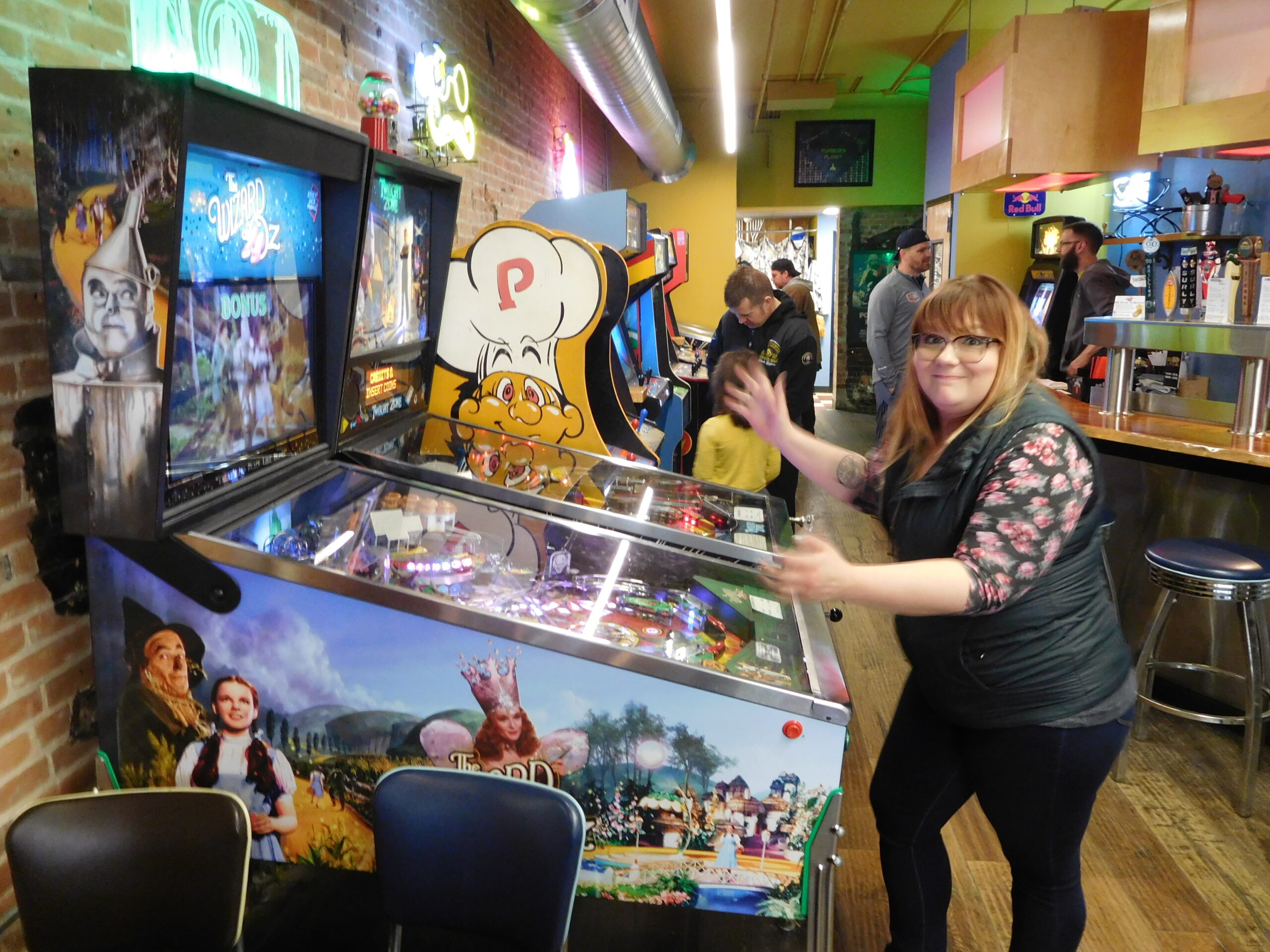 Jessica Bertling loses her ball playing Wizard of Oz pinball machine in Iowa City, IA.